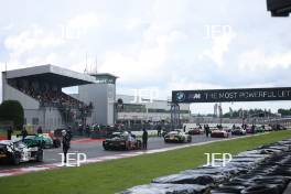 The cars stop on the grid after the race is red flagged on the formation lap due to heavy rain