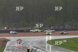 The Safety Car is deployed when a sudden rainfall causes several cars to go off at Redgate corner 