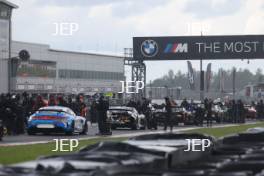 The cars stop on the grid after the race is red flagged on the formation lap due to heavy rain